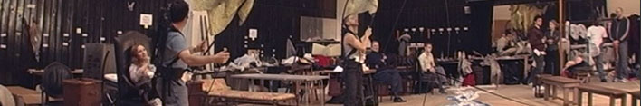 Panoramic view of a stage with actors and technicians